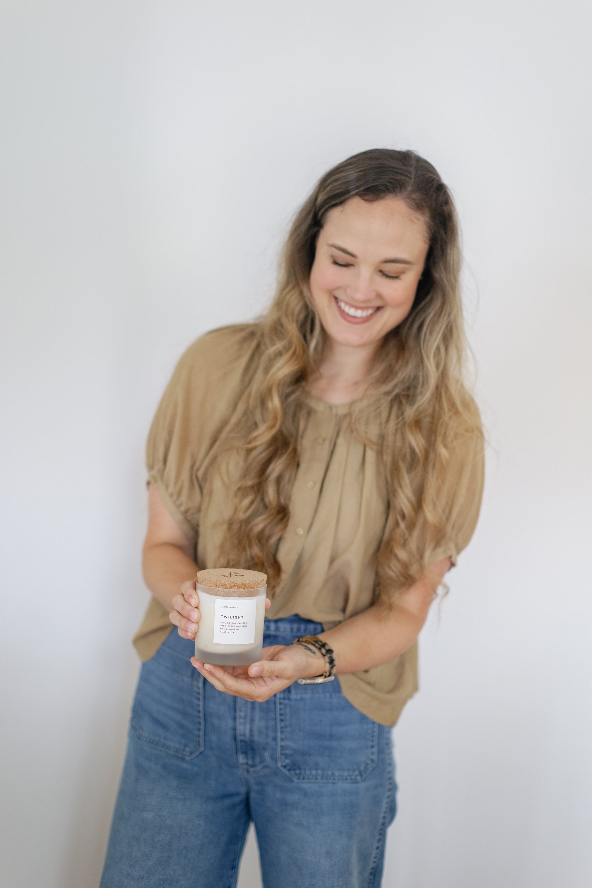 Image of Caroline holding one closed Twilight Candle