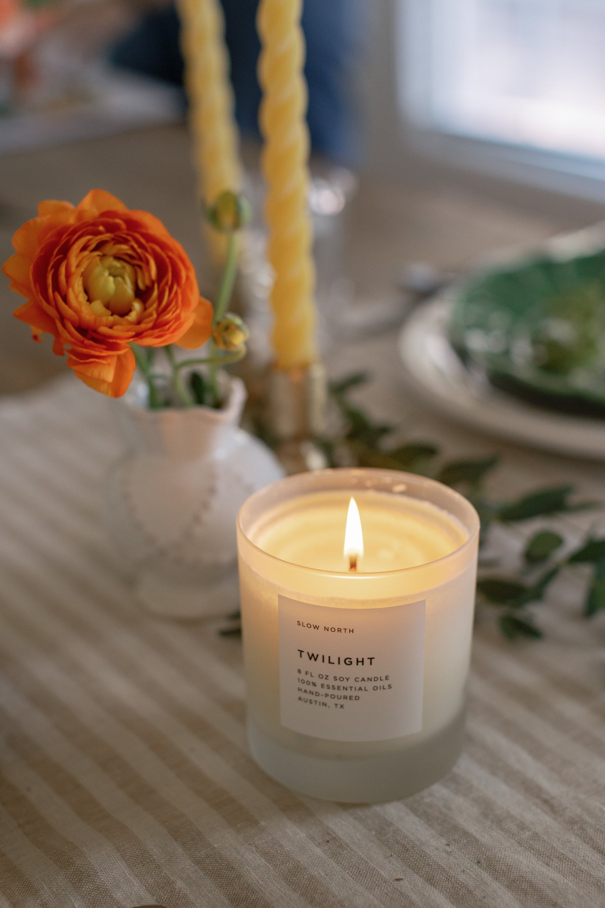 Picture of a lit Twilight Candle on a beautiful dining table