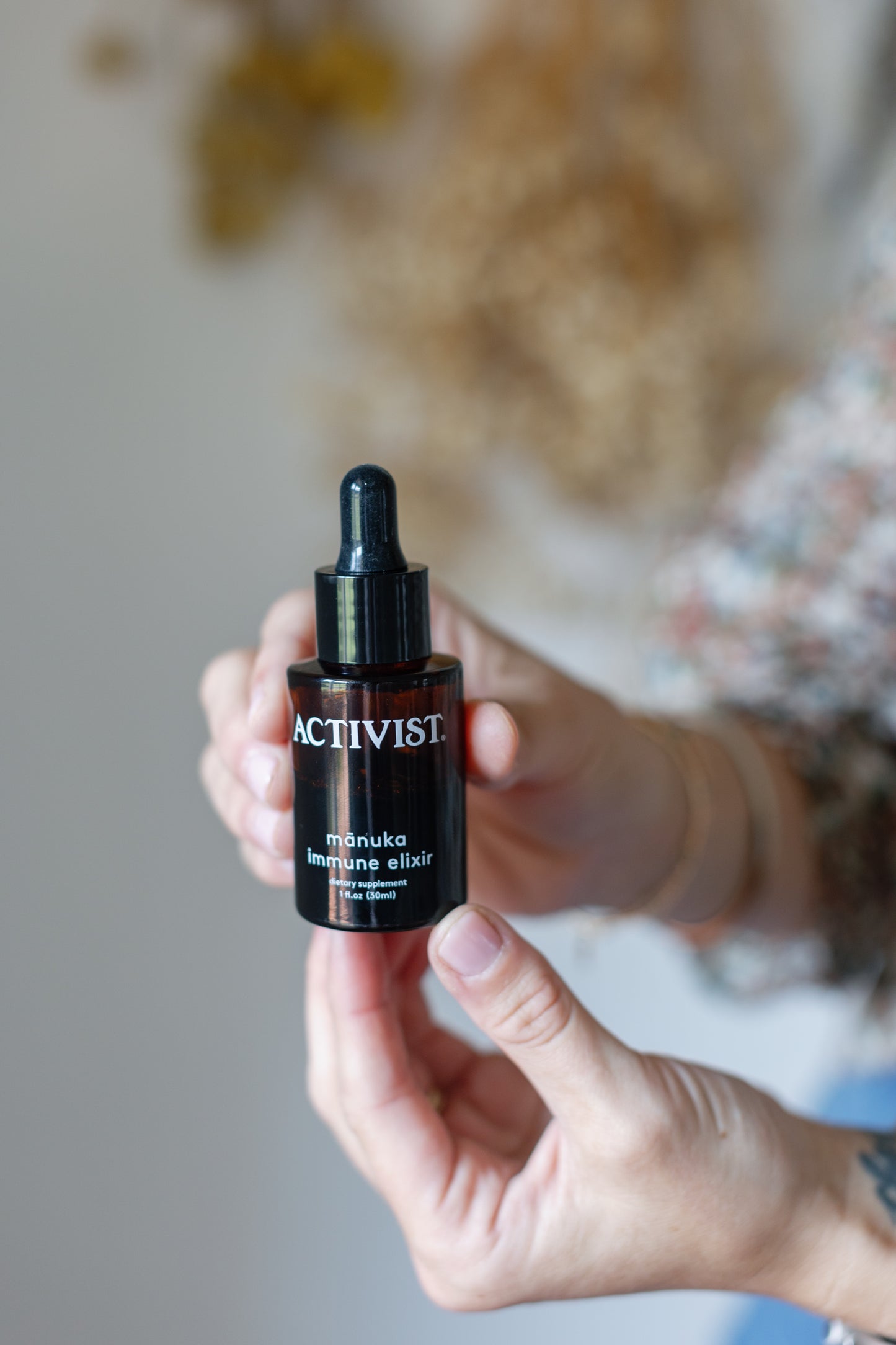 picture of some drops of the manuka immune elixir inside a tin with a dropper