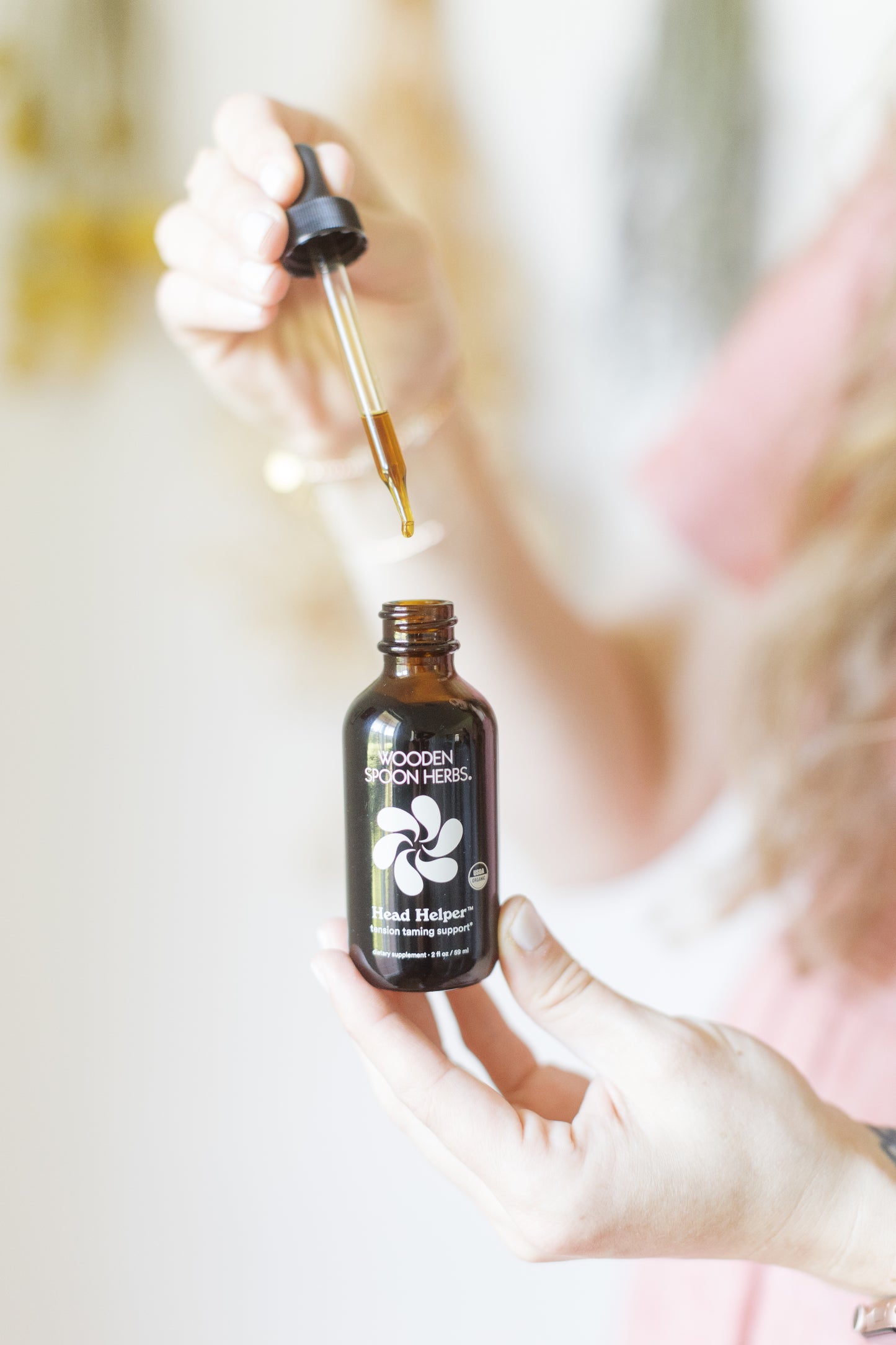 A bottle of Head Helper by Wood Spoon Herbs