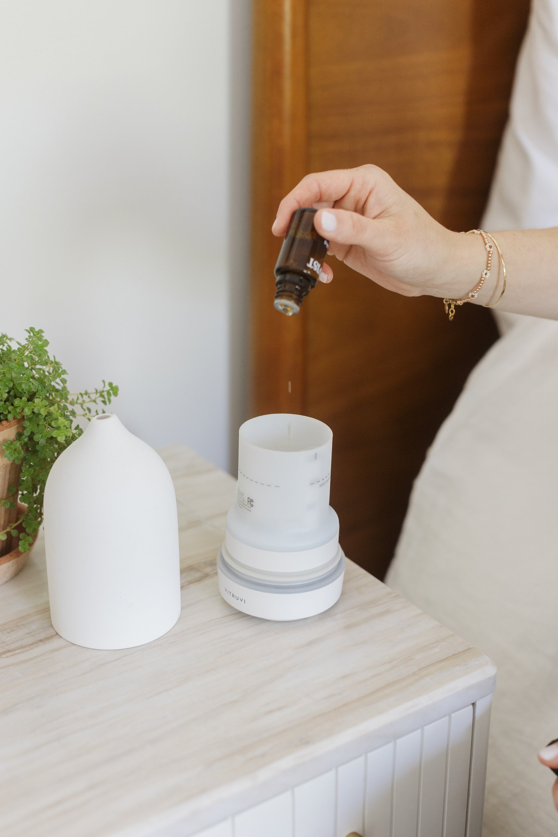 Dropping Manuka Essential Oil Into a Diffuser