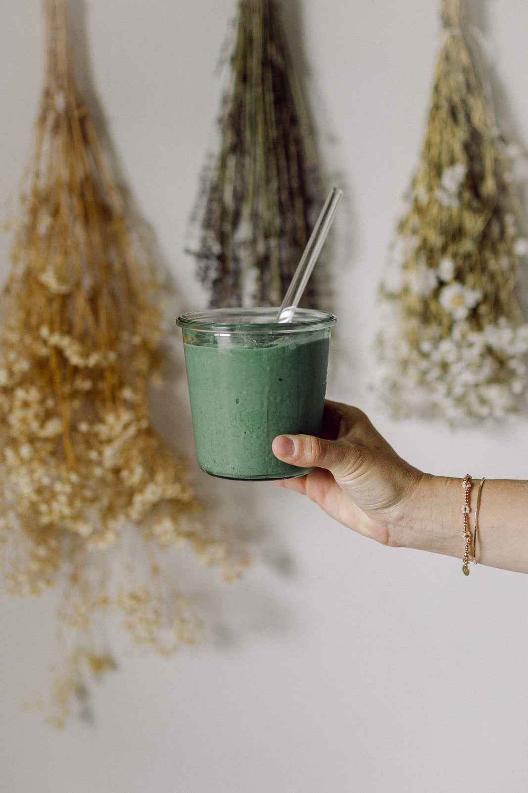 Protein shake using Cymbiotika's Plant + Greens Vanilla Protein Powder