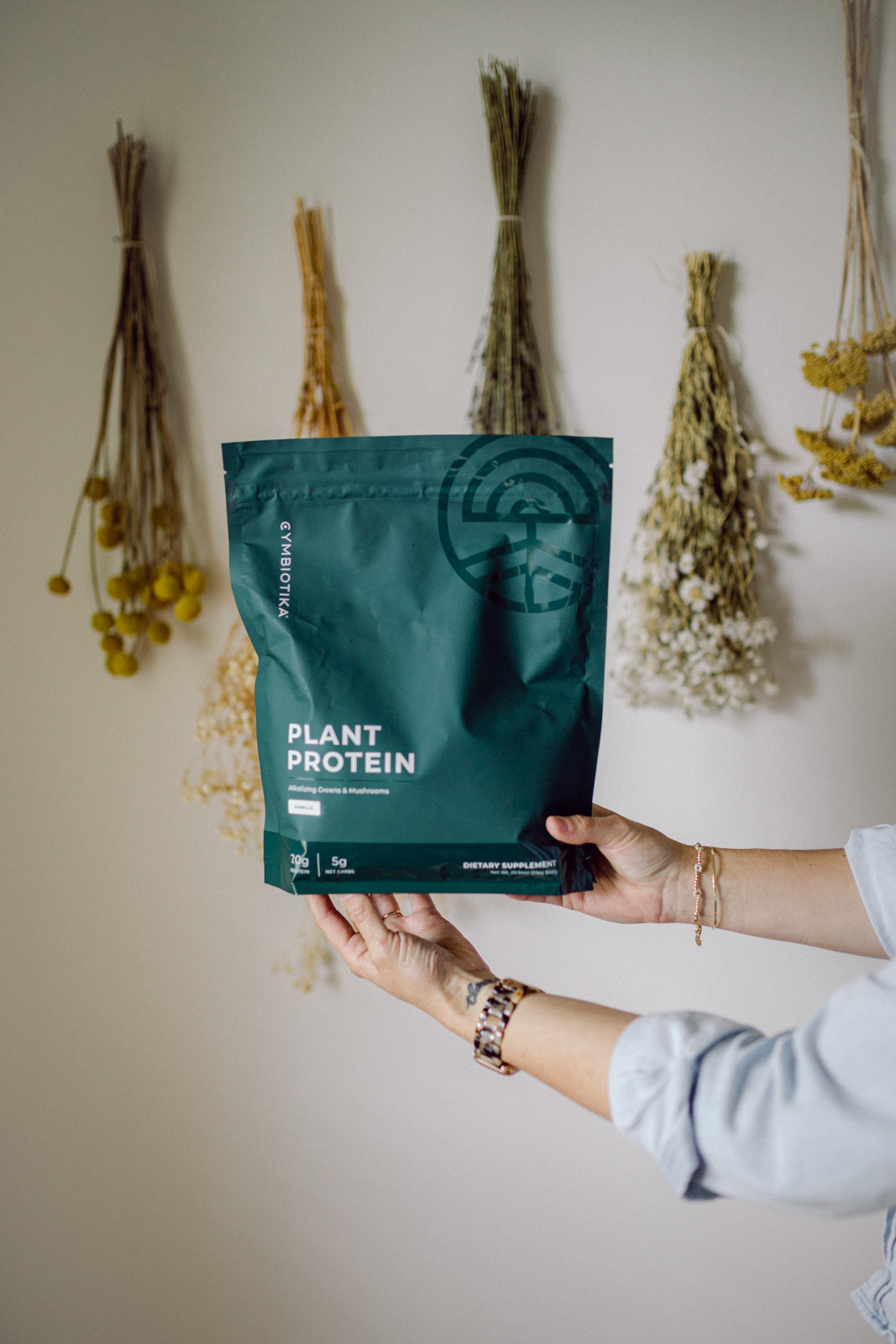 A large bag of Cymbiotika's Plant Protein Powder