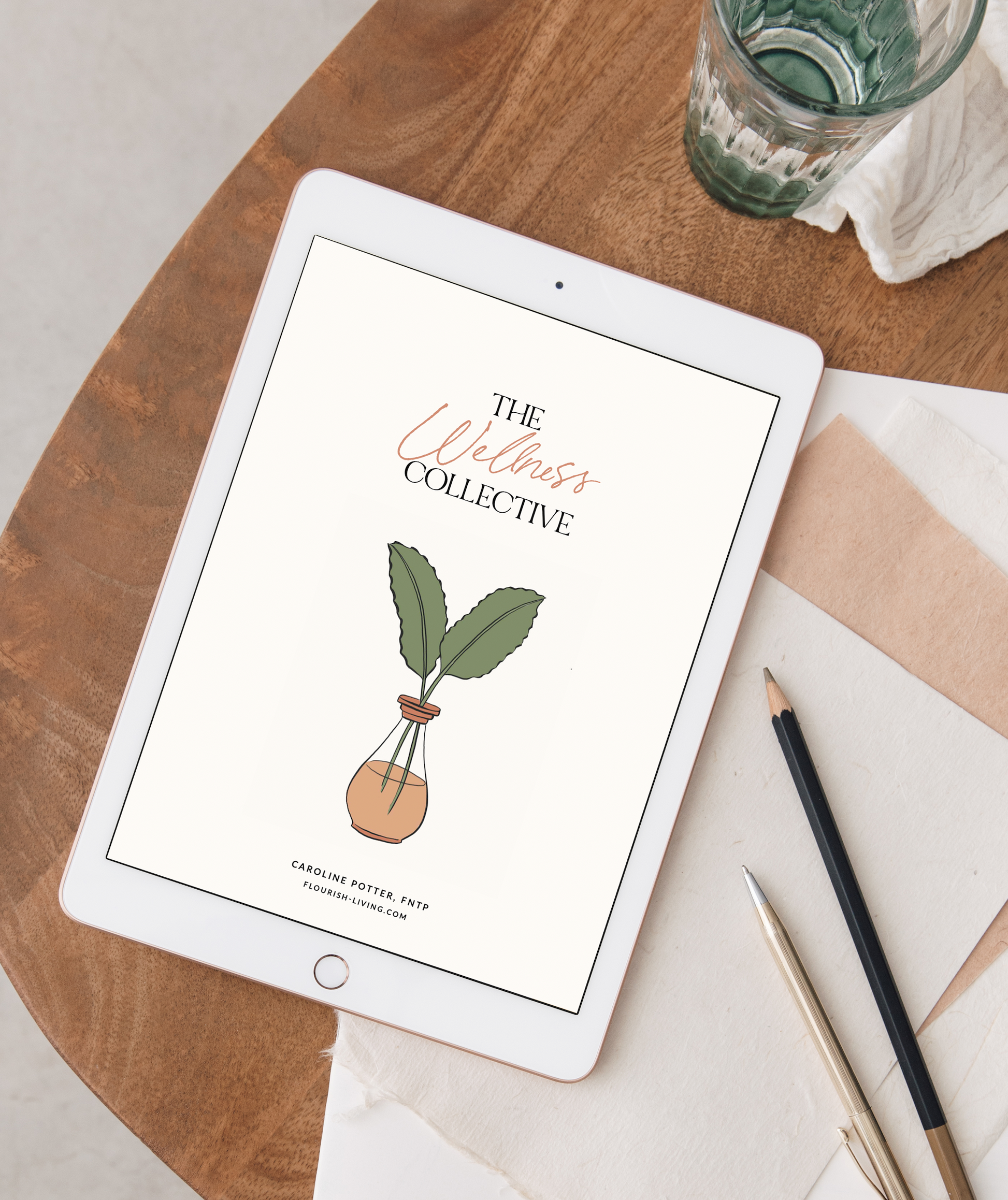 picture of an iPad showing the cover of "The Wellness Collective"
