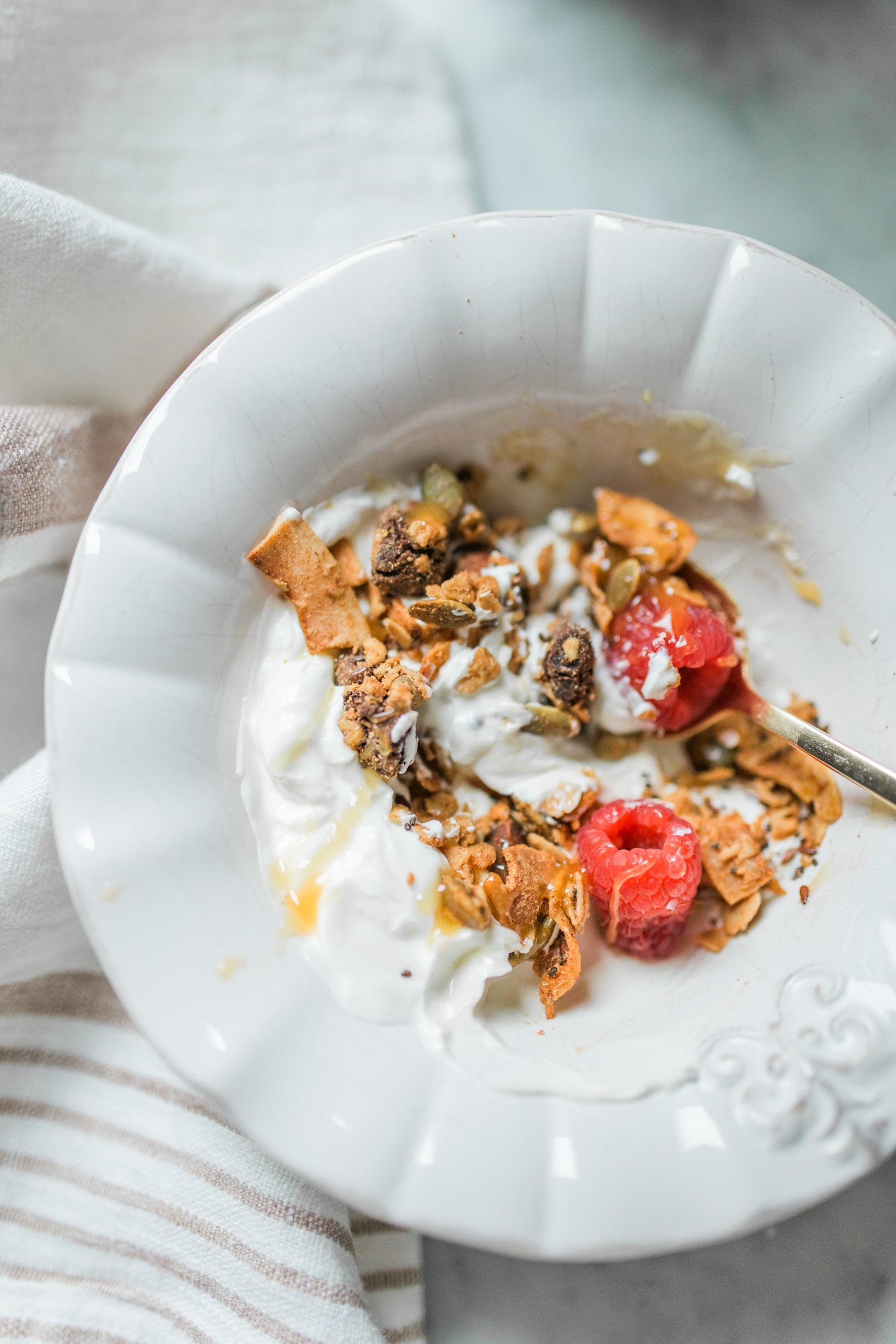 The Hampton Grocer's Almond Butter + Chocolate Chunk Granola in a healthy breakfast bowl