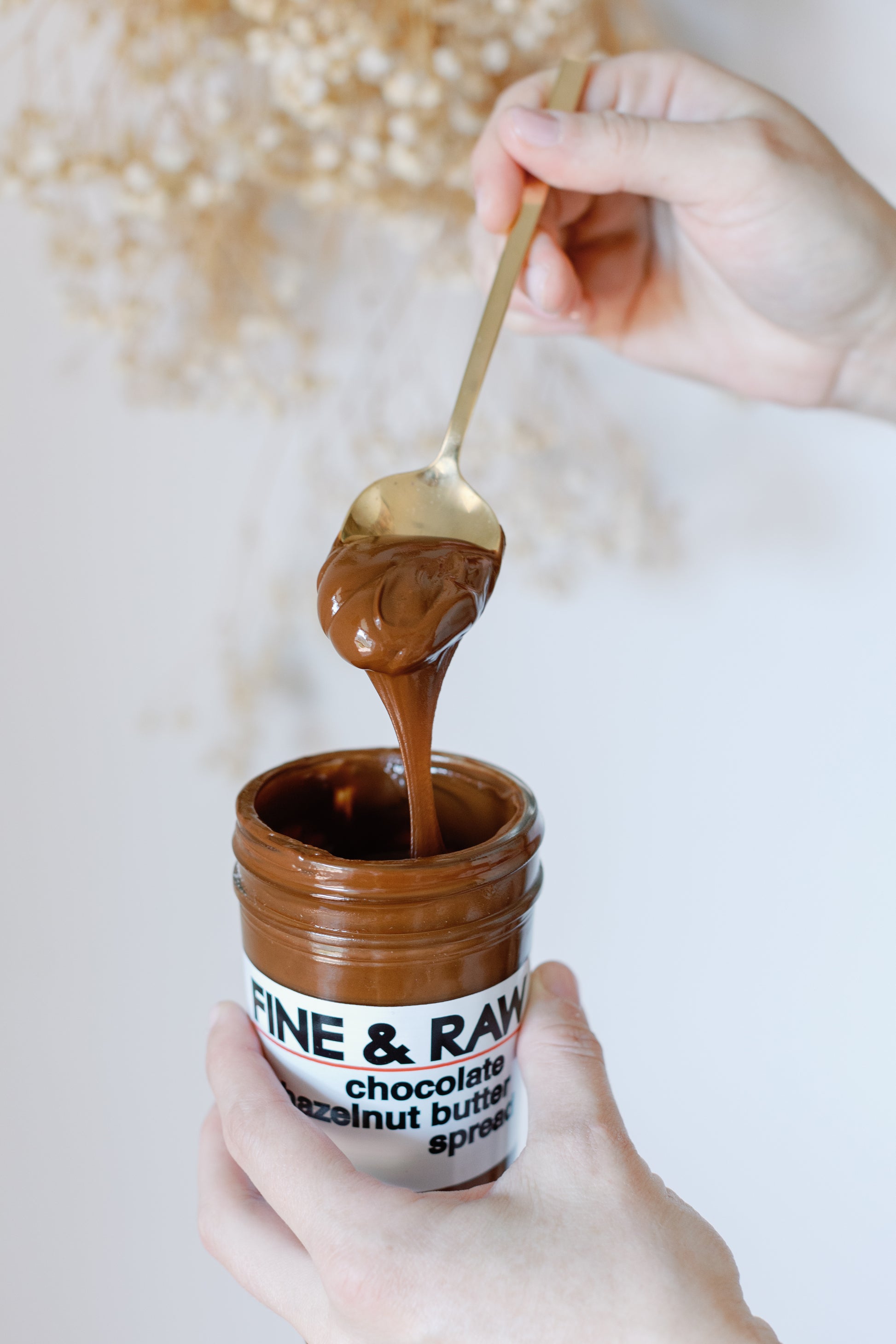 Picture of a tabletop with a Amalfi Soap Bar and the Fine & Raw Chocolate Hazelnut Butter Spread