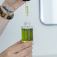 Using the dropper on the Mānuka Green Botanical Serum by Activist