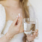 Caroline holding a Pure Radiance Vitamin C pill by Pure Synergy