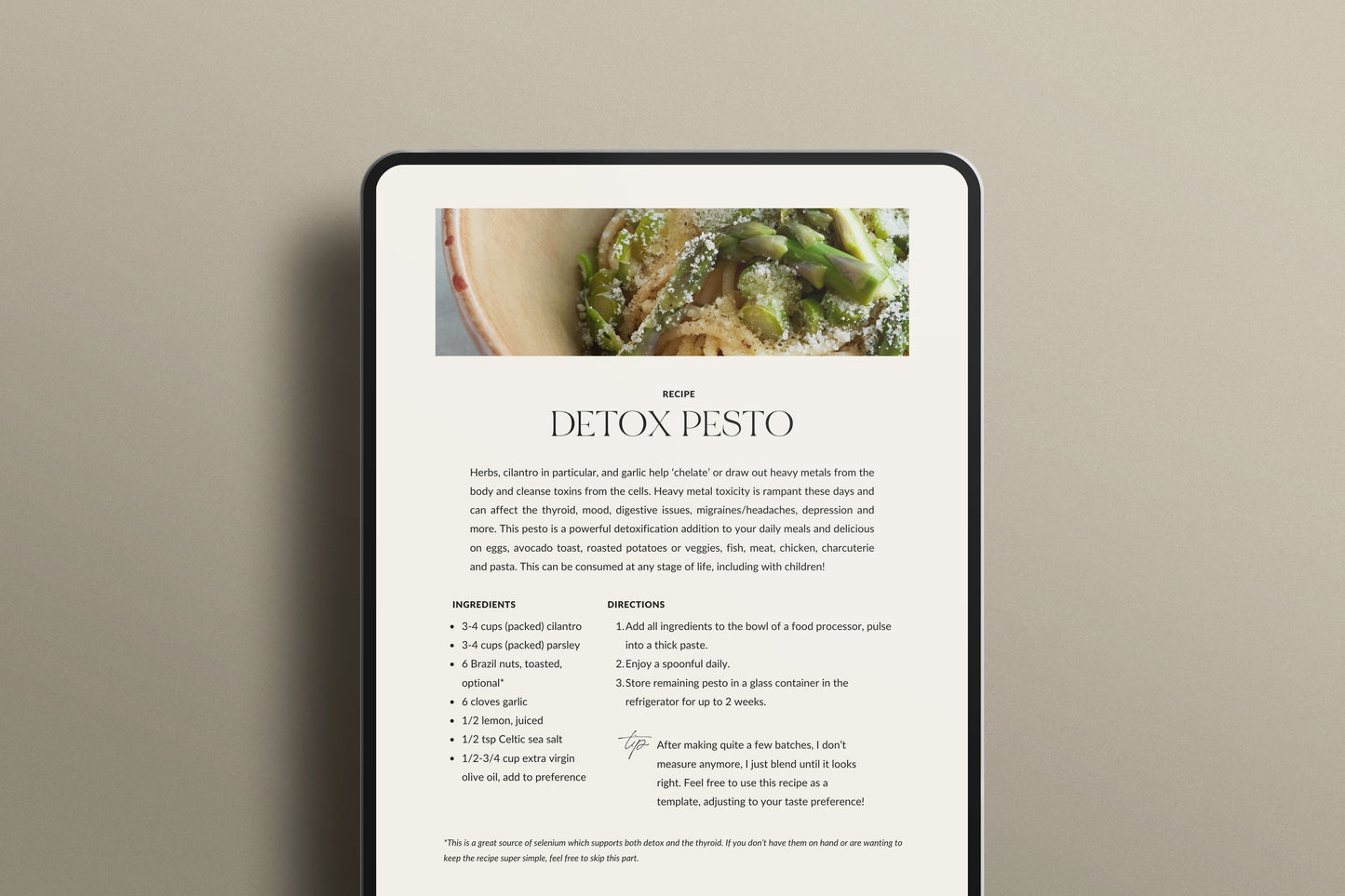 picture of the holistic migrain relief guide opened on a iPad, on a page of a Detox Pesto recipe